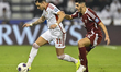 Karim Boudiaf of Qatar and Caio Canedo Correa of the United Arab Emirates are in action du...