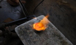 Goldsmiths work on crafting gold ornaments at a workshop ahead of Dhanteras, a Hindu festi...