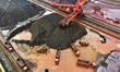 Large-scale machinery stacks and unloads iron ore at the Port of Xinsu in Lianyungang City...