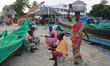 Women fish vendors are at the Chellanam Fishing Harbour on the outskirts of Kochi, India,...