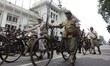 A participant wears a creative costume during the Asia Africa Festival 2025 carnival on As...