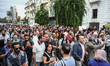 Demonstrators shout slogans as they head towards the headquarters of the Tunisian Chemical...