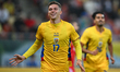Louis Munteanu of Romania reacts after scoring his side's first goal during the friendly m...