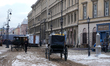 Extras and crew work amidst period-set facades on Krakowskie Przedmieście in Warsaw, Polan...