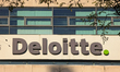The Deloitte office building displays the company's logo on the facade in Munich, Bavaria,...
