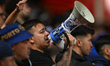 A Porto fan uses a megaphone during the UEFA Europa League League Stage match between Nott...