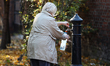 In Krakow, Poland, on October 23, 2025, people clean graves at Rakowicki Cemetery during p...