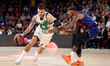 Deividas Sirvydis of Zalgiris Kaunas is in action with Will Clyburn of FC Barcelona during...