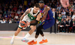 Deividas Sirvydis of Zalgiris Kaunas is in action with Will Clyburn of FC Barcelona during...