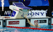 In Toronto, Ontario, Canada, on October 23, 2025, Regan Smith of the USA checks her time a...