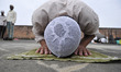 A young Nepalese Muslim offering ritual prayer at Kashmari Jame mosque on the third Friday...