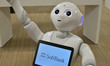 SoftBank's humanoid robot Pepper performs during a Softbank phone store in Tokyo, Japan on...