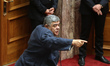 Golden Dawn leader Nikolaos Michaloliakos delivers a speech during the discussion and vote...