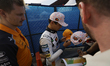 McLaren driver Lando Norris takes first place in qualifying during the autograph signing s...