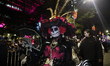 A person takes part in the Mega Procession of the Catrinas on Paseo de la Reforma Avenue,...