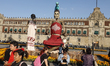 Monumental skeletons made of cardboard are seen at an offering as part of the Day of the D...