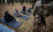 Sumy residents, armed with inert AK-47s, learn how to assemble the weapon, on October 5, 2...