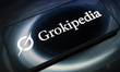 The Grokipedia encyclopedia logo appears on a smartphone screen reflecting an abstract ill...