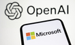 The Microsoft logo appears on a smartphone screen with the OpenAI logo in the background....
