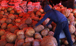 A vendor offers pumpkins to visitors at the Central de Abasto market in Mexico City, Mexic...