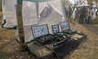 Dummy explosives and metal detectors are displayed during humanitarian demining training f...