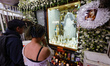 Devotees attend the altar of Santa Muerte located on Alfareria Street in the neighborhood...