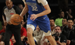 Cooper Flagg #32 of the Dallas Mavericks drives the ball during the match against the Detr...