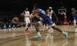 Max Christie #00 of the Dallas Mavericks drives to the basket during the match against the...