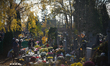Visitors are seen at the Brodno Cemetery in Warsaw, Poland on 01 November, 2025. 