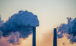 Pollution and steam rise from the stacks of the Miami Fort Power Station, which is situate...