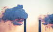 Pollution and steam rise from the stacks of the Miami Fort Power Station, which is situate...