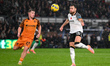 Ben Brereton Diaz of Derby County is under pressure from Joe Gelhardt of Hull City during...