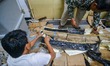 Bandung Geological Museum staff unpack a package containing Stegodon fossil tusks in the f...