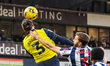 Ciaron Brown of Oxford United and Nat Phillips of West Bromwich Albion battle in the air d...