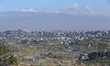 Mountain ranges are seen behind the hills surrounding the Kathmandu Valley from a hill sta...