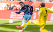 Ajax player Mika Godts (L) duels with Utrecht goalkeeper Vasilis Barkas (R) during the mat...