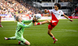 AFC Ajax Amsterdam goalkeeper Remko Pasveer and FC Utrecht forward Miguel Rodriquez play d...
