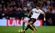 Diego Lopez of Valencia CF competes for the ball with Valentin Gomez of Real Betis Balompi...