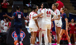 The Rutgers Scarlet Knights huddle during an NCAA women's basketball game at Jersey Mike's...