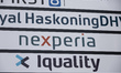 A board with the list of companies, including Nexperia logo outside of the headquaretes. N...