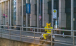 A motorcyclist wears a bright yellow Pikachu costume, the popular Pikachu character from P...