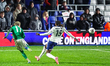 Trent Kone-Doherty fires it past Brooke Norton-Cuffy of England during the UEFA Under 21 C...