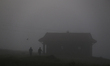 Nepali men jog around an open ground on a foggy winter morning in Lalitpur, Nepal, on Nove...