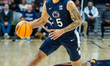 FREDDIE DILIONE V (5) dribbles the ball for the Penn State Nittany Lions during an NCAA ba...