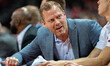 Wisconsin Badgers associate head coach Joe Krabbenhoft gives advice to the Wisconsin bench...