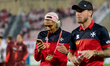 Ilyas Chouaref of Malta looks at his mobile phone as he walks on the pitch ahead of the FI...