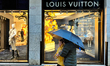 Shoppers stand in front of the Louis Vuitton Boutique in San Marco Venezia, Venice, Italy,...