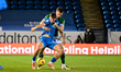 Harry Leonard (27, Peterborough United) is challenged by Callum Connolly (16, Stockport Co...