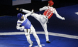 Jun Seo Bae of Korea competes against Kefen Huang of China in the Men's 58kg category duri...