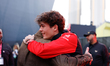 Kane Brown and Oliver Bearman hug in the paddock for the Formula 1 Heineken Las Vegas Gran...